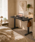 AdGiGi 40 Inch Electric Standing Desk Adjustable Height Sit Stand Workstation Compact Computer Table For Home Office Small Space Black in a cozy bedroom setup.