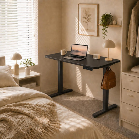 AdGiGi 40 Inch Electric Standing Desk Adjustable Height Sit Stand Workstation Compact Computer Table For Home Office Small Space Black in a cozy bedroom setup.