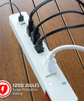 Smart Wi Fi Power Strip Surge Protector With Four Outlets Two Usb Ports Keeps Your Gear Fully Charged on wooden table.