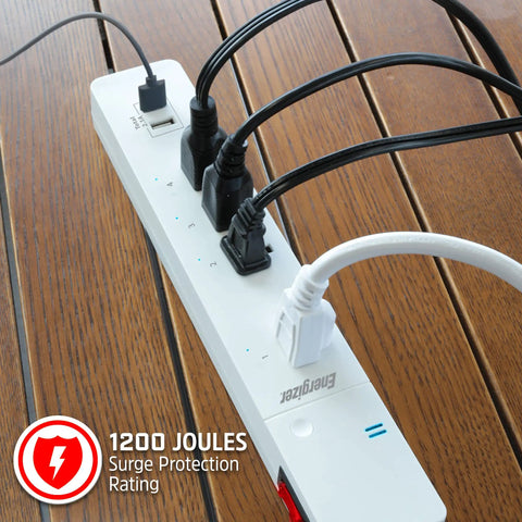 Smart Wi Fi Power Strip Surge Protector With Four Outlets Two Usb Ports Keeps Your Gear Fully Charged on wooden table.