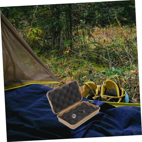 Tough Mud Color Outdoor Storage Box Shockproof All Purpose Case For Camping Hiking And Field Gear open next to camping gear in forest.