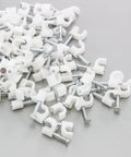 Bulk pack of white 100 Round 5/32 Inch Cable Wire Clips Nail In Coaxial Cable Management Cord Tie Holder Clamps Tacks on grey background