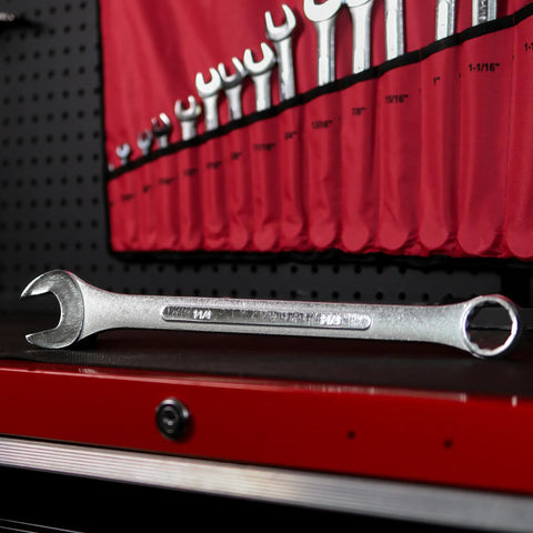 Raised Panel 16-Piece Combination Wrench Set SAE Standard 1/4 In To 1-1/4 In, displayed on a red tool bench with a wrench rack.