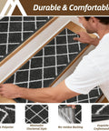 Man applying No Slip Peel And Stick Stair Treads For Wooden Steps 9x28 Inches Indoor Runners Dark Grey 15 Pack Safe For Kids Elders And Pets 100 Percent Polyester With TPE Backing