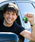Person in car holding Helmet Shape Sublimation Keychain Blanks Kit, 20 Pieces With Rings And Clips For DIY Ornaments