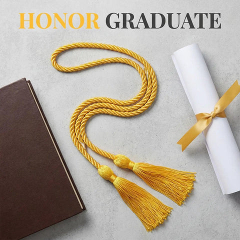67 Inch Gold Graduation Honor Cord With Tassels next to diploma and book on gray background