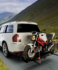 600LBS Motorcycle Carrier Hitch Mounted Rack With Loading Ramp Wheel Chock And Straps attached to SUV transporting bike