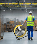 Worker moving yellow 30 Inch High Velocity Industrial Drum Fan Delivers Up To 14000 CFM Beast-Level Airflow, wheeled design