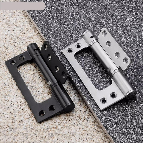 Two Hidden Stainless Steel Door Hinges With Hydraulic Buffer Damping Slick Spring Loaded Cabinet Door Closer Rust Resistant Furniture Hardware 5 Inch Easy Install For Smooth Soft Close Doors And Cabinets, one black and one silver, displayed on stone tiles.