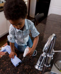 Child using Granite Cleaner And Polish For Marble Quartz Slate And Concrete Surfaces Streak Free Stone Countertop Cleaner