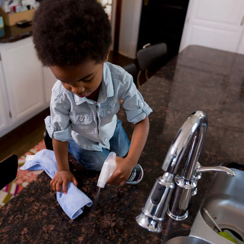Child using Granite Cleaner And Polish For Marble Quartz Slate And Concrete Surfaces Streak Free Stone Countertop Cleaner