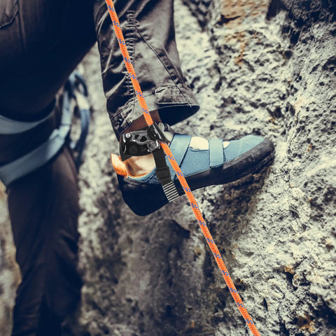 Climber using Right Foot Ascender for Climbing and Rappelling Pro Grade Lightweight Aluminum Magnesium Alloy on rock face