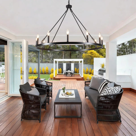 Wagon Wheel Farmhouse Chandelier in Black and Wood, 6 Light Rustic Industrial Pendant Light Fixture in modern patio setting