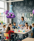 Six Pack Jumbo Flask Foil Balloons For Mad Scientist Party Decor in a STEM classroom setting with kids and teacher.