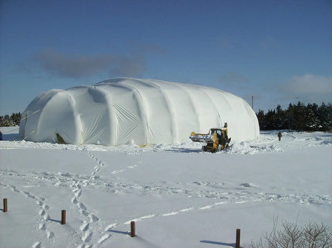 Snow-covered large dome secured with 46 Inch Aluminum Screw Ground Anchor with 1/2 Inch Guying Slot, Heavy Duty Beast That Holds Up To 14,000 Lbs