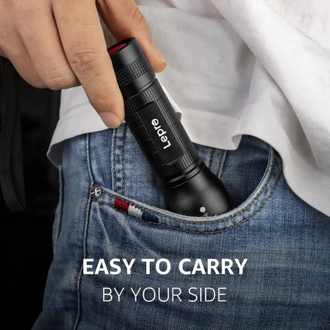 Ultra Bright LED Flashlight With Zoomable Lens pocket size being placed into jeans pocket for easy carry