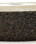 Seven Inch Convolute Deburring Wheel One Inch Thick By One Inch Arbor Hole Silicon Carbide Fine Grit showing dense abrasive texture.