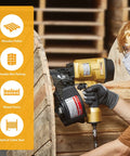 Worker using Coil Siding Nailer Workhorse For Wood Projects on a large cable reel, showcasing durable aluminum housing.