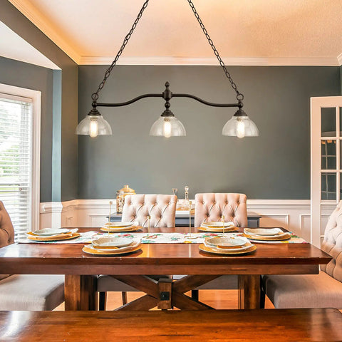 3-Light Kitchen Island Pendant Light Fixture With Clear Glass Shades Rustic Black Farmhouse Chandelier in a dining room