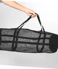 Large Mesh Sports Gear Bag For Gym And Outdoors, black breathable tote in hand, suitable for diverse sports equipment and travel.