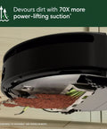 Underside view of Roomba 205 DustCompactor Vacuum Robot With No Dock Needed and 60 Days Between Empties in action on floor.