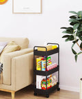 Three Tier Rolling Storage Cart With Adjustable Shelves, Mobile Utility Organizer On Wheels For Kitchen, Bath, And Laundry, Narrow Space Saver In Black Finish next to a couch holding snacks.
