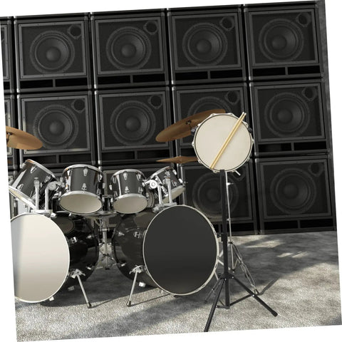 Heavy Duty Alloy Folding Drum Rack With Hinged Height Adjustment Quick Release Clamps Snare Bass Drum Holder next to speakers.