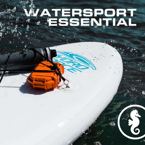 Micro Waterproof Dry Box Case Yellow IP67 Lockable Hard Shell Container With Carabiner Loop For Earbuds PLB Iems And Small Medical Devices Usa Made Mil Spec Tough As Nails Build Built Different Rugged Polycarbonate Protection Lifetime Warranty on surfboard with water splashes.