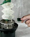 Hand adjusting Northstar 1500 Lumen Gas Lantern With Matchless Lighting, focusing on lantern mantles and knob