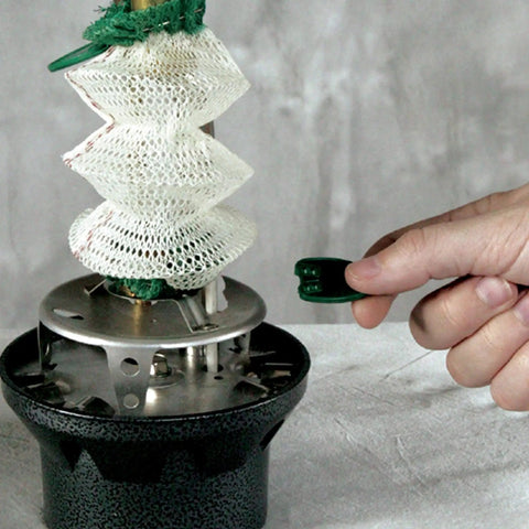 Hand adjusting Northstar 1500 Lumen Gas Lantern With Matchless Lighting, focusing on lantern mantles and knob