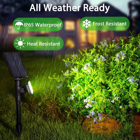 4 Pack Solar Spotlight Lights Outdoor Waterproof Landscape Lighting illuminating garden in rain, highlighting plants