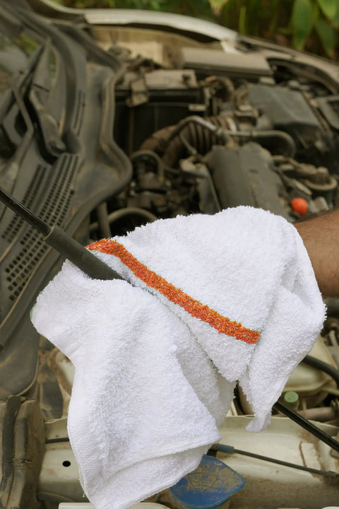 Person using 60 Pack 16 By 19 Inch Terry Bar Mop Rags For Cleaning Absorbent And Durable Cotton Cloths Multipurpose Shop Towels in garage