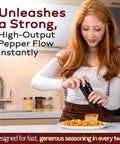Woman using the Unicorn Pepper Mill By Tre Spade Premium Kickin Manual Pepper Grinder on pasta in a kitchen setting.