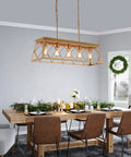 Five Light Gold Modern Farmhouse Chandelier For Kitchen Island above a dining table with wooden chairs in a decorated dining room, UL Listed.