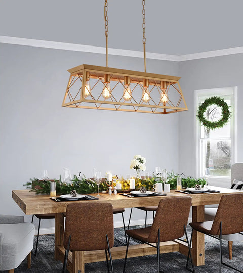 Five Light Gold Modern Farmhouse Chandelier For Kitchen Island above a dining table with wooden chairs in a decorated dining room, UL Listed.