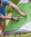 Person using Crystal Clear Duct Tape 1.88 Inch By 5 Yard Heavy Duty All Purpose Tape Weatherproof And Airtight on green tent
