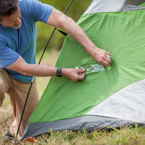 Person using Crystal Clear Duct Tape 1.88 Inch By 5 Yard Heavy Duty All Purpose Tape Weatherproof And Airtight on green tent