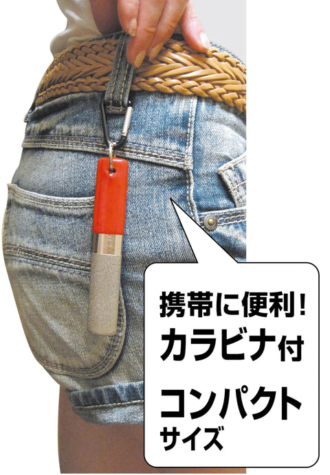 Diamond Sickle Sharpener With Carabiner For Rough Or Finishing Edge attached to denim shorts.