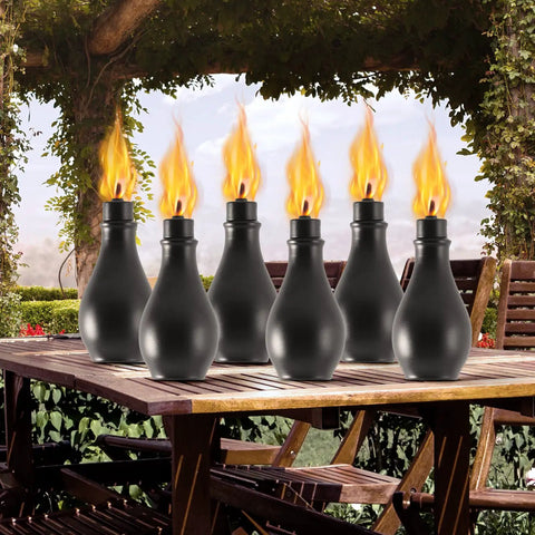 Six Pack Outdoor Metal Torches With 3 Prong Grounded Stakes Extra Large 59 Inch Citronella Torches displayed on a patio table