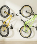 Fat Tire Bike Wall Mount Swivel Hanger Holds 4.5 Inch Wide Tires Up To 77 Lbs holding yellow and green bikes on wall