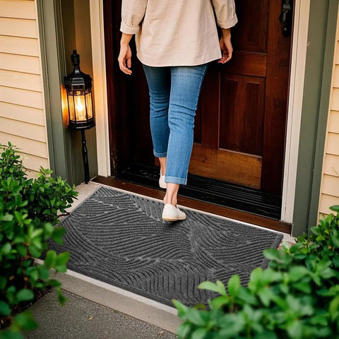 All Weather Outdoor Doormat With Simple Stripes Waterproof Non Slip Heavy Duty Front Door Mat For Indoor Garage And Patio Dark Grey 29 By 17 Inches Now placed at a front door with a person walking over it.