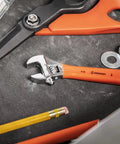 10 Inch Adjustable Cushion Grip Wrench With Non Slip Hex Jaw For Precise Tightening in a tool drawer with scissors and washers