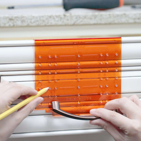 DIY Friendly No-Fuss All In One Cabinet Door And Drawer Drill Mounting Template For Precise Knob And Pull Installation in use on drawer