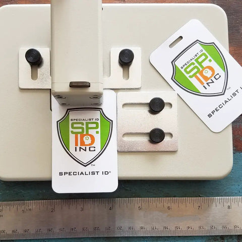 Heavy Duty Desktop Slot Punch For ID Cards And Bulk Badges With Precision Adjustable Slide Guides, showing ID cards and punch mechanism.