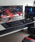 Large Topographic Gaming Mouse Pad 31.5 By 11.8 Inches With Smooth Surface Grippy Non Slip Base And Stitched Edge Extended Desk Pad XL Desk Mat For Gaming And Work Black displayed on a desk with computer setup