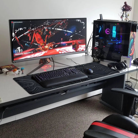 Large Topographic Gaming Mouse Pad 31.5 By 11.8 Inches With Smooth Surface Grippy Non Slip Base And Stitched Edge Extended Desk Pad XL Desk Mat For Gaming And Work Black displayed on a desk with computer setup