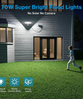 70W Motion Sensor Plug In Outdoor Flood Light No Hardwire Needed Dusk To Dawn 7000LM IP65 Waterproof LED Security Light With 6500K PIR Sensor For Garage Yard Patio Eave Black installed on house exterior wall illuminating backyard