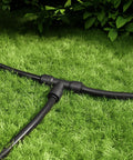 Quick Connect Drip Irrigation Tee Connectors For One Quarter Inch Tubing Universal Barbed Fittings Leak Free Sprinkler And Drip System Solution 15 Pack No Fuss Install For Garden Irrigation installed on grass