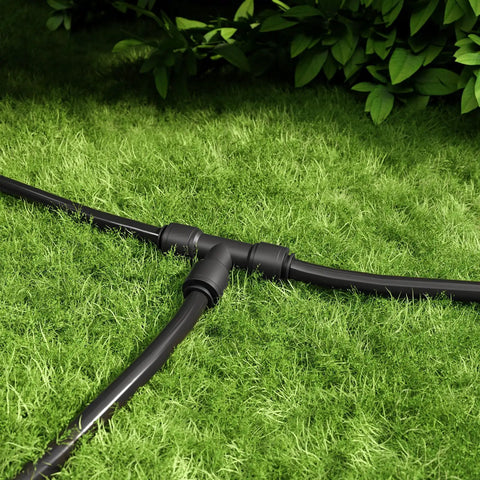 Quick Connect Drip Irrigation Tee Connectors For One Quarter Inch Tubing Universal Barbed Fittings Leak Free Sprinkler And Drip System Solution 15 Pack No Fuss Install For Garden Irrigation installed on grass