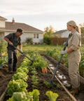 Two people using 2-In-1 Garden Hoe With Adjustable 30-75 Inch Long Handle For Weeding And Tilling in a vegetable garden